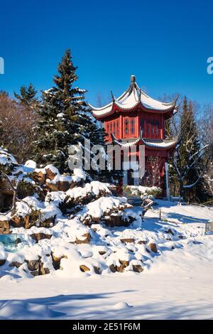 January 24, 2021 - Montreal Botanical Garden, Quebec, Canada - The Tower of Condensing Clouds at Chinese Garden in winter with snow - Montreal Botanic Stock Photo