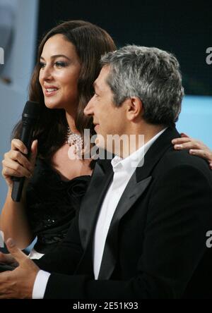 Actress Monica Bellucci and Alain Chabat during the broadcasting of 'Le Grand Journal' TV show on Canal Plus channel on the Martinez beach during the 61st Cannes Film Festival in Cannes, France on May 19, 2008. Photo by Denis Guignebourg/ABACAPRESS.COM Stock Photo