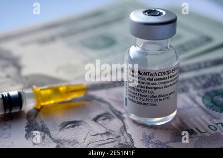 Genuine Pfizer BioNTech COVID-19 Vaccine vial. Real vaccine photo. Selective focus. Stafford, United Kingdom - January 23 2021. Stock Photo