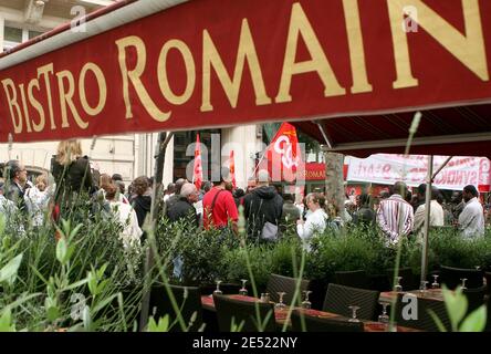 Illegal migrant workers stand in front of the 'Bistro Romain' restaurant on the Champs-Elysees avenue in Paris, France on June 6, 2008 . The would be immigrants have taken up the place since May 20, claiming for the straightening out of their status. Photo by Stephane Gilles/ABACAPRESS.COM Stock Photo