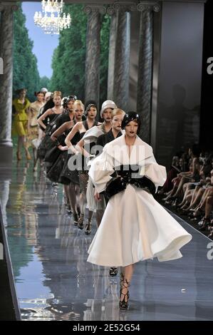 Models display a creation by British designer John Galliano for