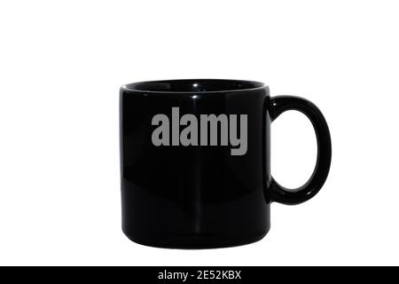 Black ceramic mug isolated on white background. Copy space for your design Stock Photo