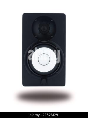 Front view of professional high quality monitor speakers for sound recording, mixing, and mastering in studio in black wooden casing isolated . Stock Photo