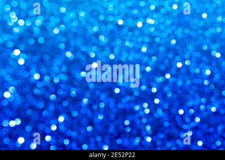 Abstract blue glitter lights background. Circle blurred bokeh. Festive backdrop for Christmas, holiday or event. Winter Card or invitation Stock Photo