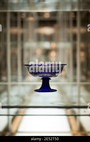 An ornate cobalt blue glass pedestal bowl on display at the Museum of Applied Arts (MAK) in Vienna, Austria. Stock Photo