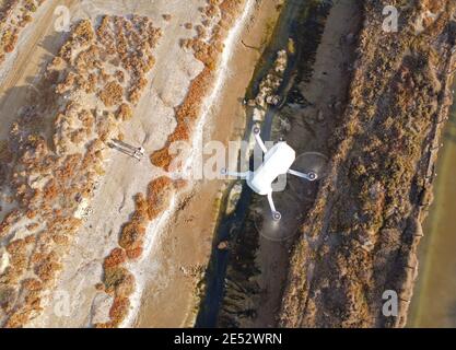 DJI Mavic Mini drone in flight Stock Photo