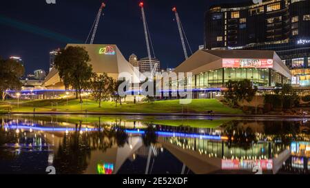 The festival centre and the adelaide cityscape reflecting in the river torrens at night in South Australia on January 25th 2021 Stock Photo