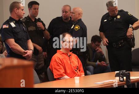 Kent, Washington, USA. 18th Feb, 2011. On his 62nd birthday, GARY RIDGWAY, the Green River serial killer, sits surrounded by numerous police and corrections officers before pleading guilty to aggravated first-degree murder in the death of Rebecca Marrero at the Maleng Regional Justice Center. Ridgway was sentenced to an additional life sentence as part of his 2003 plea deal. Ridgway was convicted in 2003 of the murders of 48 other women. Rebecca ''Becky'' Marrero was last seen on December 3, 1982 and is the 49th confirmed victim of the Green River Killer. Marrero's skull was found December Stock Photo