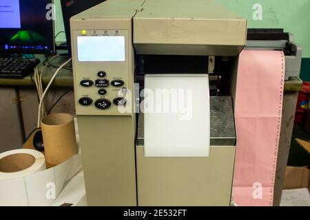 Sticker label printer. Barcode digital printer and applicator machine. Stock Photo
