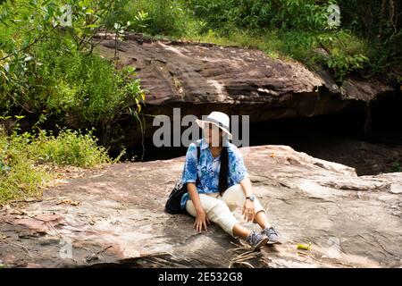 Thai travelers women people travel visit and playing water take photo at Tham Buang Waterfall in jungle on Phu Foi Lom in Pa Phan Don National Forest Stock Photo