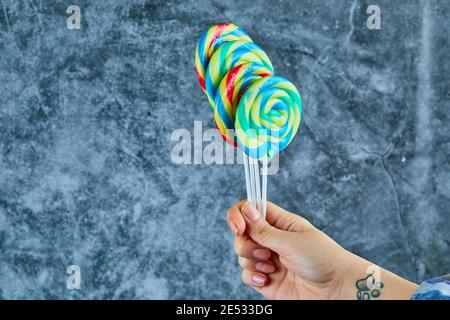 Colorful lollipops on marble background Stock Photo