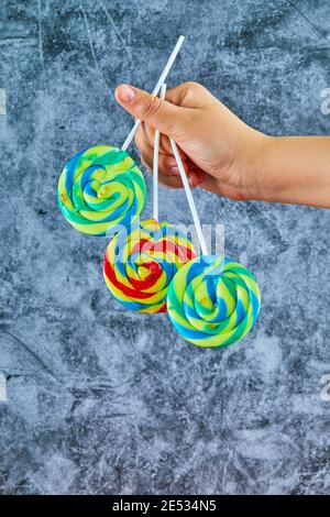 Colorful lollipops on marble background Stock Photo