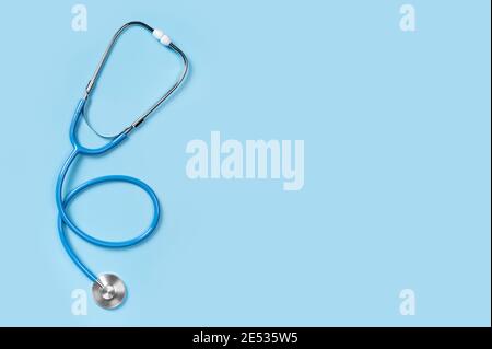 Medical stethoscope isolated on blue background. stethoscope is an important diagnostic tool for doctor. listening to the lungs for inflammation. copy Stock Photo