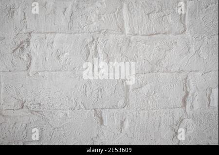 texture of rough white brickwork close-up. background plaster on top of bricks. Close up of old worn and weathered brick wall. Masonry clinker bricks, Stock Photo