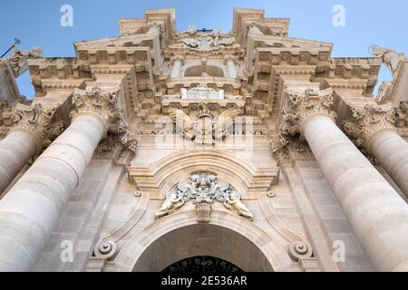 The marble facade of the Cathedral of Syracuse shot from below in a sunny summer day Stock Photo