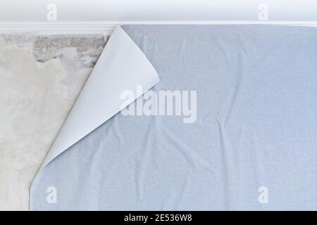 Glued paper textured gray wallpaper on a non-woven base. Creative abstract background. Stock Photo