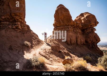 A woman hiking the Sentinel loop trail in Kodachrome Basin State Park Utah, USA. Stock Photo