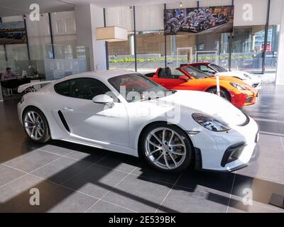 Herzliya, Israel - January 24, 2021: Porsche showroom with brand new models and a White GTS. Stock Photo