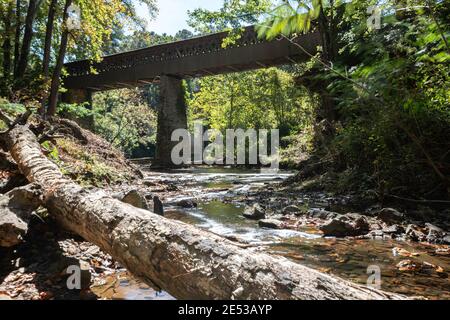 Bethel, Alabama/USA-Oct. 17, 2020: Long exposure shot of Crooked Creek with the Clarkson Covered Bridge in the background. The Clarkson Covered Bridge Stock Photo