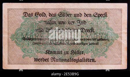 Nazi Germany. The 1000 Mark's banknote with anti semitic overprint. 1930s Nazi party advertising 1932 election propaganda 'leaflet' created by printin Stock Photo