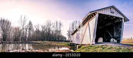 Rushville, Ohio/USA-January 5, 2019: Panoramic web banner of the historic R.F. Baker Covered Bridge originally built in 1871, also known as the Winega Stock Photo