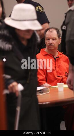 Kent, Washington, USA. 18th Feb, 2011. GARY RIDGWAY, whose 62nd is today, the Green River Killer, looks downward as REBECCA MARRERO, the mother of Ridgway's 49th known victim Rebecca ''Becky'' Marrero walks past him before Ridgway plead guilty to aggravated first-degree murder in her death of Becky during court proceedings at the Maleng Regional Justice Center in Kent. Ridgway was sentenced to an additional life sentence as part of his 2003 plea deal. Ridgway was convicted in 2003 of the murders of 48 other women. Becky last seen on December 3, 1982 and is the 49th confirmed victim of the G Stock Photo