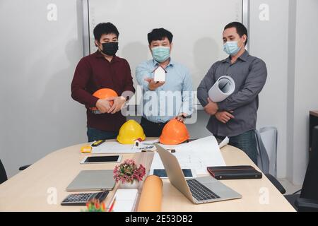 Engineer and Architect concept, Engineer Architects  and Interior designer working with blueprints Stock Photo