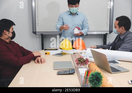 Engineer and Architect concept, Engineer Architects  and Interior designer working with blueprints Stock Photo