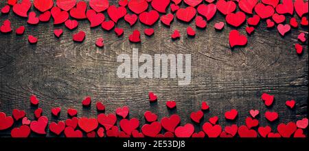 Valentine Card - Red Hearts On Wooden Table Stock Photo