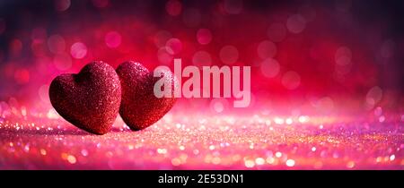 Abstract Defocused Valentines Card With Red Hearts On Shiny Glitter Stock Photo