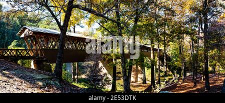 Bethel, Alabama/USA-Nov. 10, 2018: Panorama of the 270-foot, Clarkson-Legg Covered Bridge built in 1904 that spans Crooked Creek in Cullman County. Stock Photo