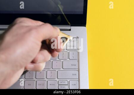 Person using contactless tool for press button to protect themselves from contracting coronavirus infection Stock Photo