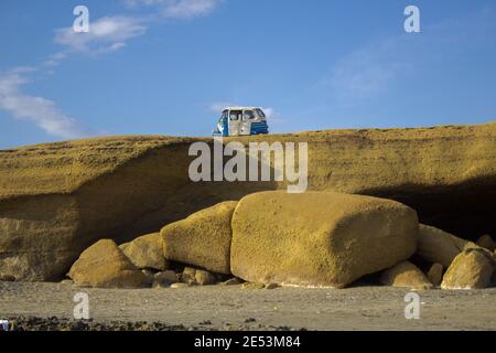 SAN JUAN DE MARCONA, PERU - Jan 15, 2015: A horizontal shot of a motorcycle taxi parked on rocks Stock Photo