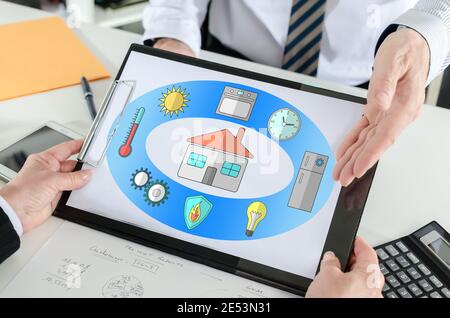 Smart home concept shown by a businessman Stock Photo