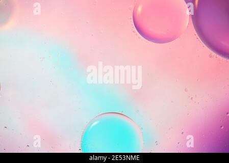 Defocused pastel colored abstract background picture made with oil, water and soap Stock Photo