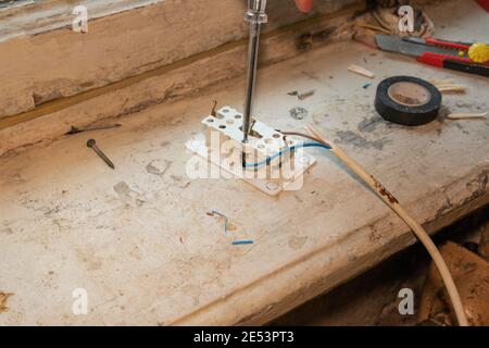 electrician outlet voltage work replacing the socket new cable Stock Photo