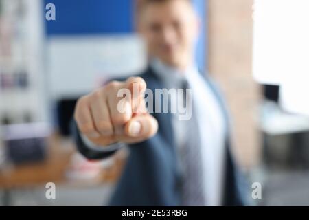 Man in business suit pointing his finger in front of him closeup Stock Photo