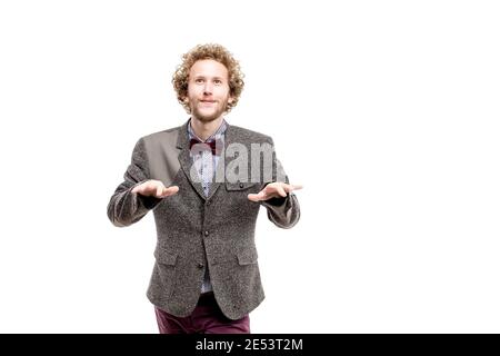 A young successful businessman with curly hair wearing formal suit, isolated on white. Stock Photo