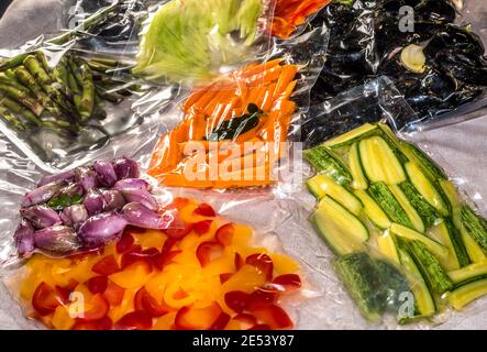 https://l450v.alamy.com/450v/2e53y87/vacuum-sealed-bags-for-sous-vide-cooking-with-peppers-and-courgettes-and-shallots-fresh-carrots-and-asparagus-and-mussels-2e53y87.jpg