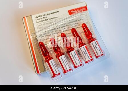 Hydroxocobalamin acetate ampoules, vitamin B12a. Red coloured solution for injection in the treatment for vitamin B12 deficiency. Accord Healthcare Stock Photo