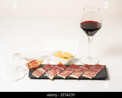 Spanish tapas, iberian loin, sausage. Iberian Acorn Ham and red wine Stock Photo