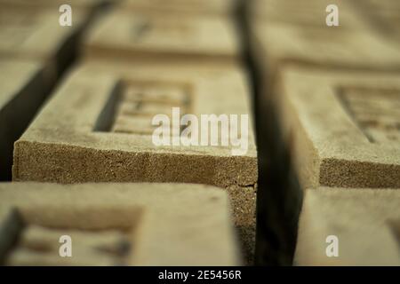 Raw Brick closeup Drying Up Raw Bricks and block used to build walls Stock Photo