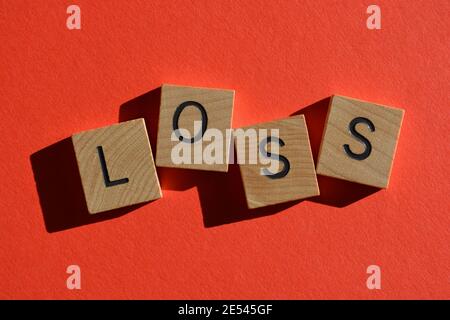 Loss, word in wooden alphabet letters isolated on bright red background Stock Photo