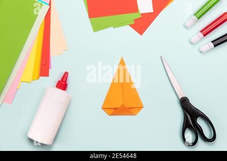 How to make Origami paper bookmark form of carrot for Easter greetings. Children's art project. DIY concept. Step by step photo instruction. Step 2 Stock Photo