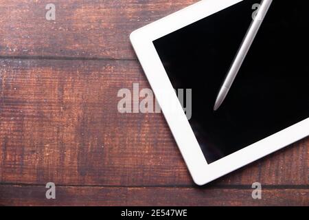 Flat composition of digital tablet and pen on table with copy space  Stock Photo