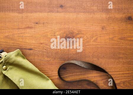 Shoulder bag ready for a travel over wooden background Stock Photo