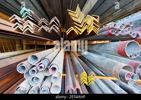 Close-up wide-angle view of aluminum bars and metal steel pipes for sale at a hardware store in the Philippines, Asia Stock Photo