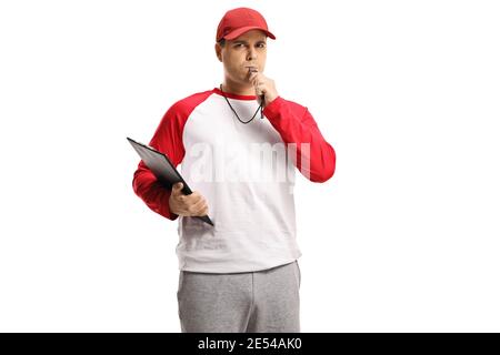 Angry baseball coach holding a clipboard and blowing a whistle isolated on white background Stock Photo