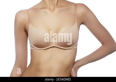 Beautiful part of female body. Spa, wellbeing and healthcare. Breast care.  Perfect woman's form, flat belly, sexy breasts in beige bra lingerie. Healt  Stock Photo - Alamy