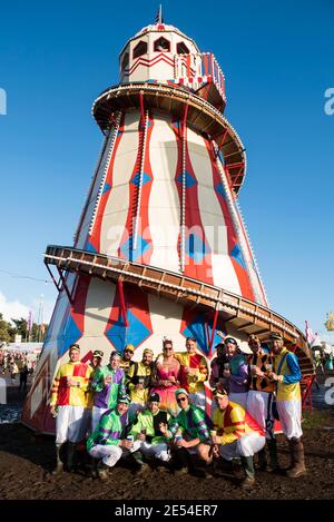 Festival goers in fancy dress stand in front of the Helter Skelter at Bestival 2017 at Lulworth Castle - Wareham. Picture date: Saturday 9th September 2017. Photo credit should read: David Jensen/EMPICS Entertainment Stock Photo